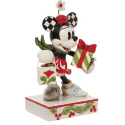 Jim Shore - Disney Traditions - Minnie With Bag And Gift 11 Jim Shore - Disney Traditions - Minnie With Bag And Gift -Jim Shore Sales Store 510870 Jim Shore Disney Traditions Minnie With Bag And Gift angled right 20013.1657908533